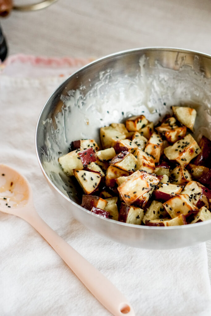 air fryer sweet potato in a bowl with glaze
