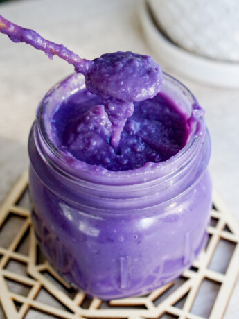 purple Okinawan sweet potato jam with spoon in jar