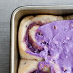 purple sweet potato cinnamon rolls semifrosted overhead view