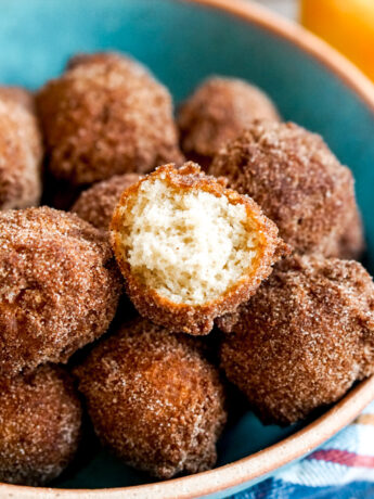 closeup of apple cider mochi donuts with bite taken out