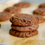stack of three nutella cookies on a baking tray