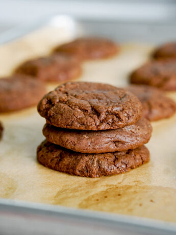 stack of three nutella cookies on a baking tray