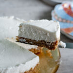 no-bake yogurt cheesecake slice held up by a knife