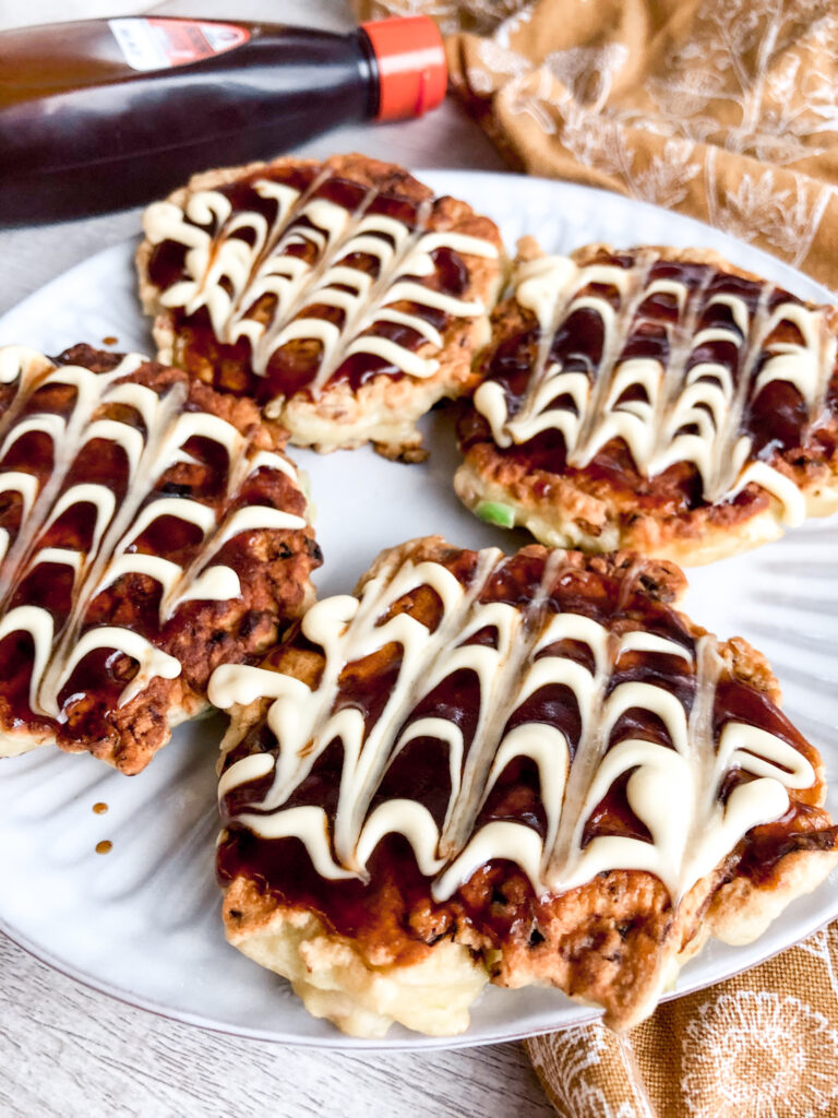 mini okonomiyaki with sauce in the background