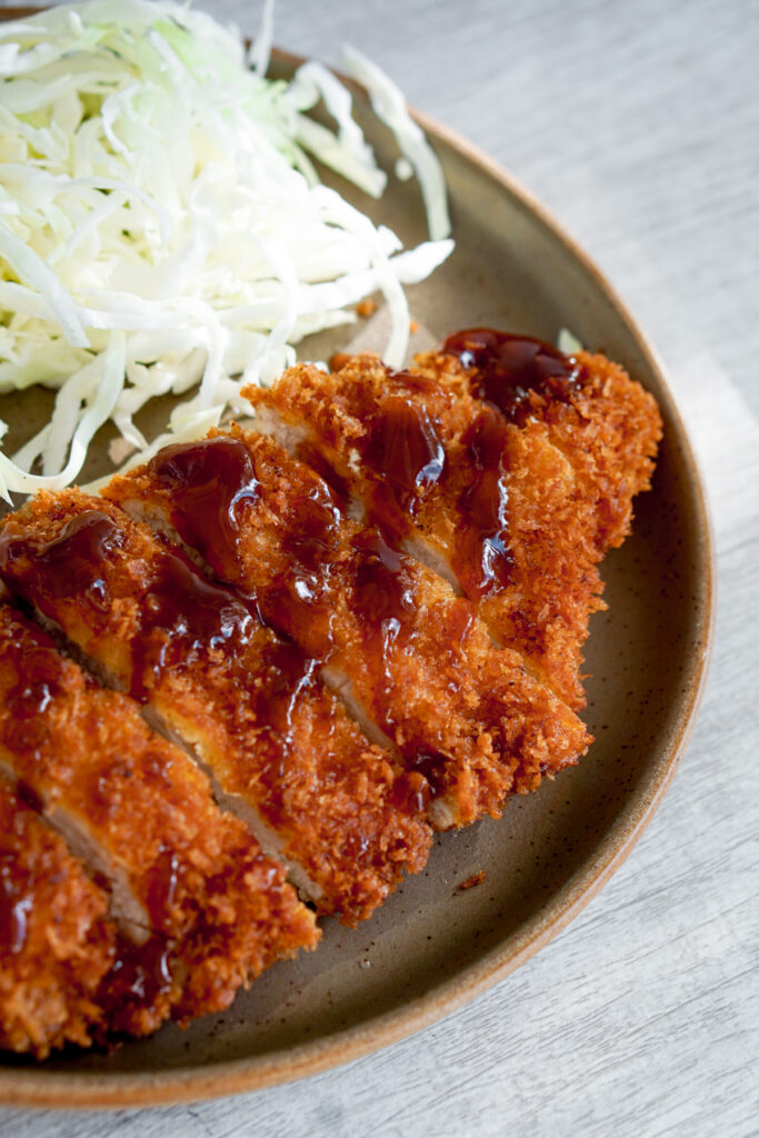 chicken katsu with tonkatsu sauce and cabbage
