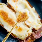 japanese roasted sweet potato creme brulee with golden spoon holding brulee piece