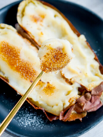 japanese roasted sweet potato creme brulee with golden spoon holding brulee piece